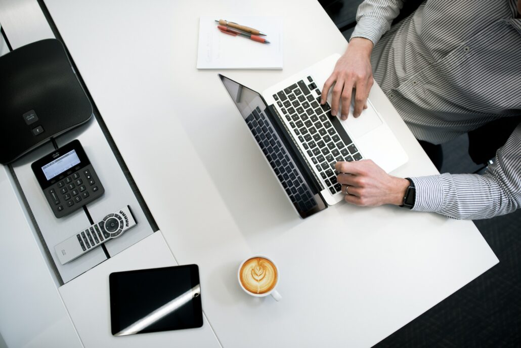 man sitting at a computer